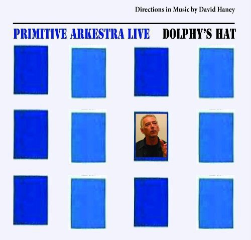 "Album cover with blue squares and a man's portrait in the center square."