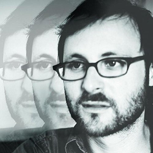 Black and white image of a man with glasses, repeated four times.