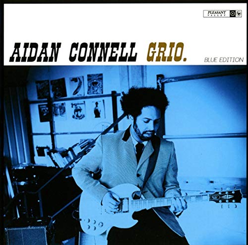 Album cover with a man playing an electric guitar, blue-toned image.