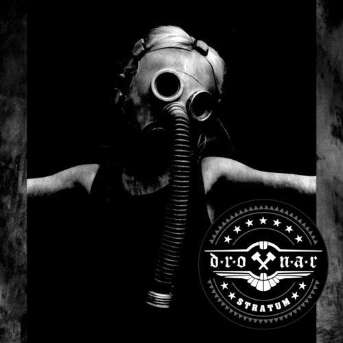Person wearing gas mask, dark background, and band logo with stars.