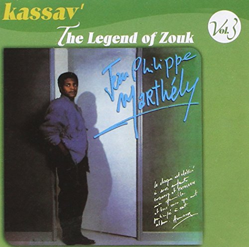 "Kassav' album cover featuring a man in a doorway, green background, autographed."