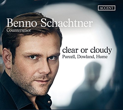 "CD cover featuring a man with short brown hair and a blurred background."