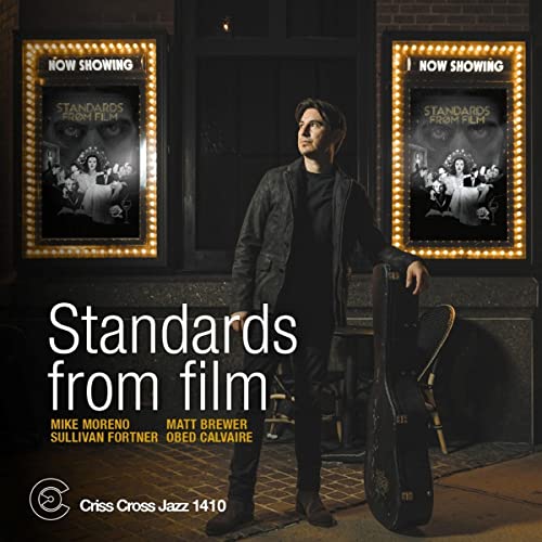 Mike Moreno album cover featuring a man with a guitar case.