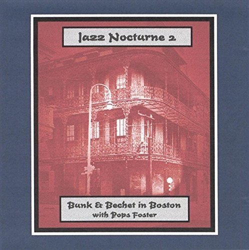 Album cover featuring a red-toned building image with text overlays on a blue background.