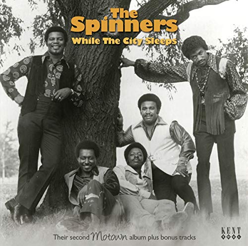 The Spinners' album cover: five men posing around a tree in black and white.