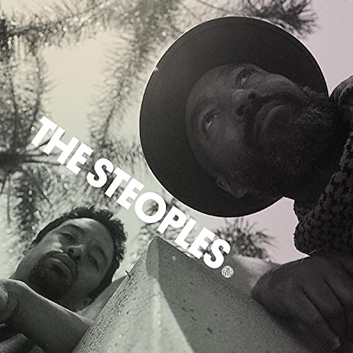 Black and white album cover featuring two men looking upwards.