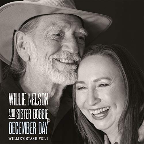 Black and white album cover featuring Willie Nelson and a woman smiling together.