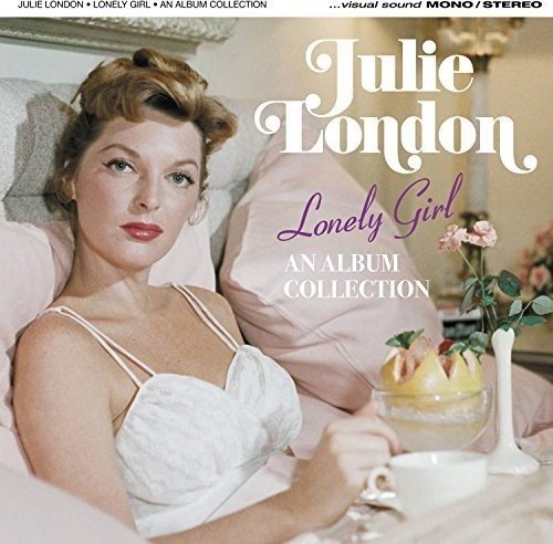Julie London reclines in bed, wearing a white negligee, on the album cover.
