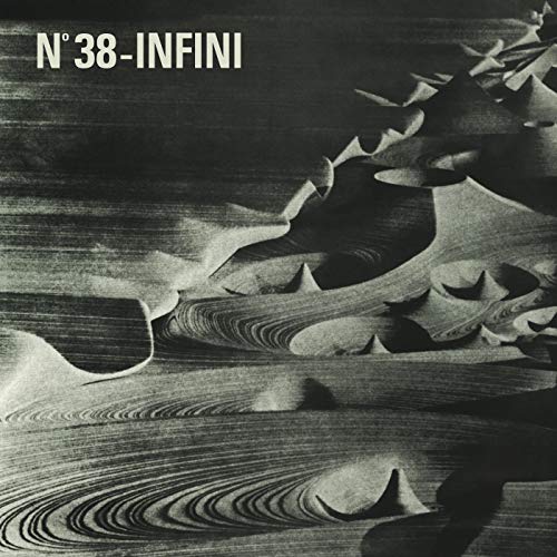 Black and white vinyl record cover with abstract, layered landscape art.