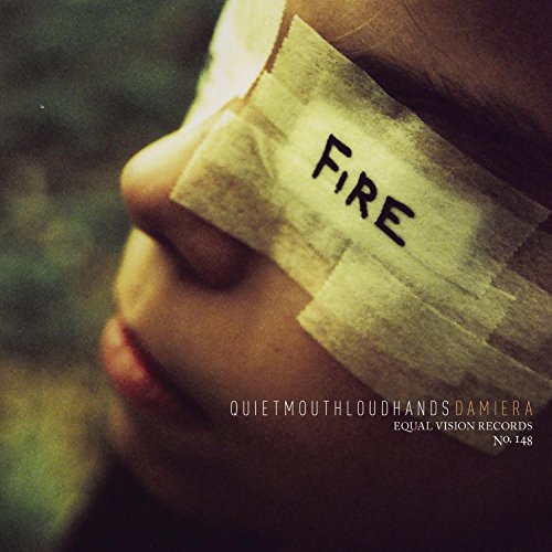 Close-up of a person with the word "FIRE" taped over their mouth.