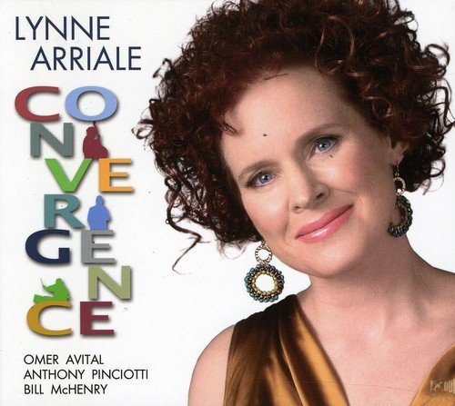 Jazz album cover featuring a smiling woman with curly red hair and gold earrings.