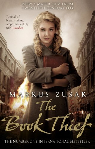 The image shows a book cover with a woman holding a book amidst burning buildings.