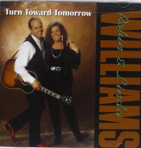 "CD cover with man and woman, man holding guitar, brown and black design."