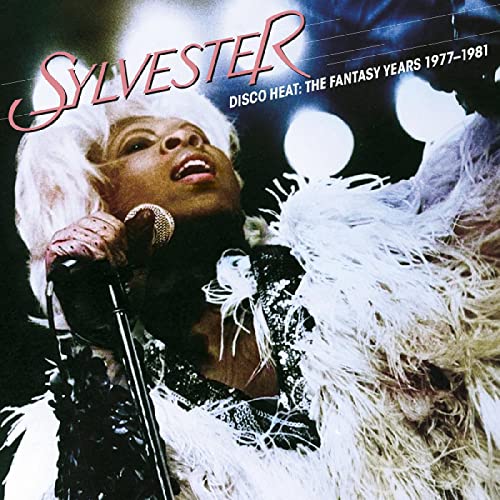 Sylvester in white fur, singing into a microphone, album cover.