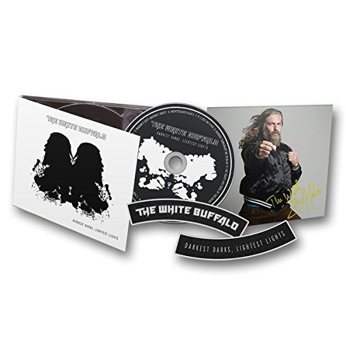 "CD case with disc and booklet featuring a man with long hair."
