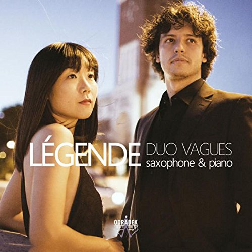 "CD cover featuring a man and woman, Duo Vagues, with cityscape background."