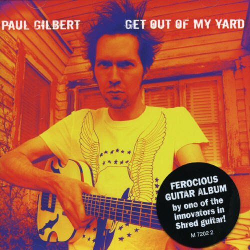 Album cover of Paul Gilbert holding a guitar, with a house in the background.