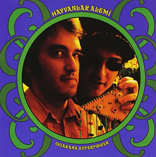 CD cover: portrait of a man with a guitar, green and purple design.