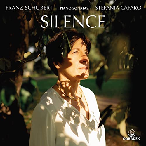 CD cover featuring pianist Stefania Cafaro in sunlight, with foliage.