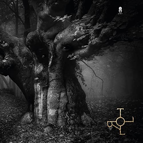 Dark, misty forest with a gnarled tree and a symbol at the bottom.