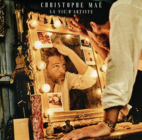 "Album cover showing a man looking in a lighted vanity mirror."