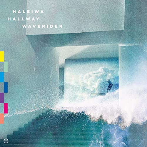 Surfer riding a wave framed by concrete architectural structures.