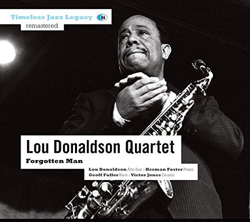 Black and white image of a man holding a saxophone on a CD cover.