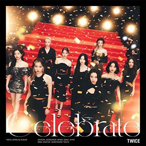 Nine women of Twice pose on a red carpet with confetti and lights.