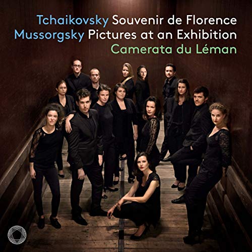 "CD cover featuring 15 musicians in black posing on a wooden staircase."