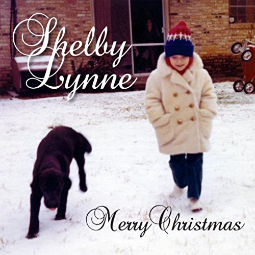 "Shelby Lynne's 'Merry Christmas' album cover: a child and dog in snowy yard."