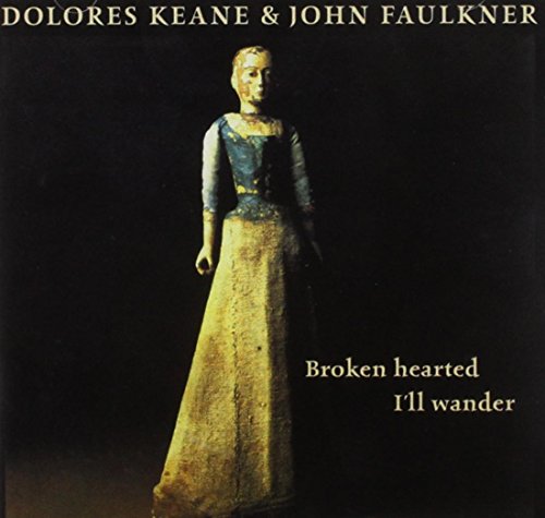 "CD cover featuring a figurine of a woman in a long dress against a black background."
