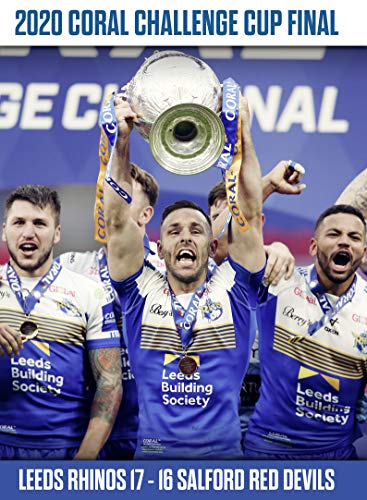 Leeds Rhinos players celebrating with the Coral Challenge Cup trophy.