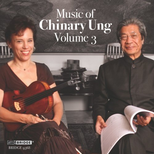 "CD cover featuring a man and woman with a violin, smiling."