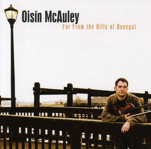 "CD cover featuring a man leaning on a wooden railing with a lamppost nearby."