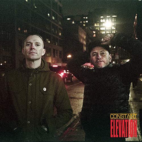 Album cover featuring two men in dark jackets against a city backdrop.