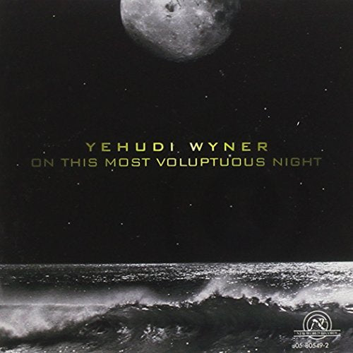 "Album cover with moonlit ocean waves and yellow text on black background."