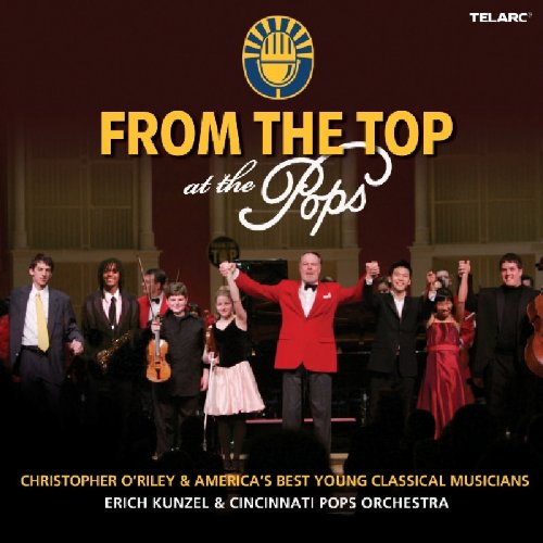 "CD cover featuring young musicians and conductor on stage with celebratory gestures."