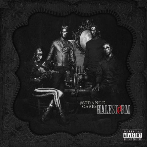 "Black and white album cover with four band members in dark attire."