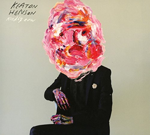 Album cover featuring a person in a suit with a colorful, abstract painted face.