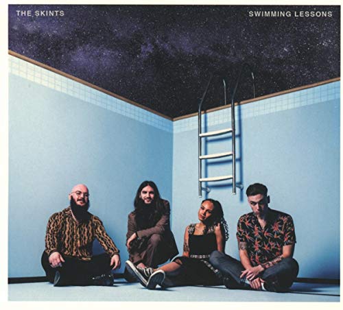 Album cover with four band members sitting in a blue-tiled empty swimming pool.