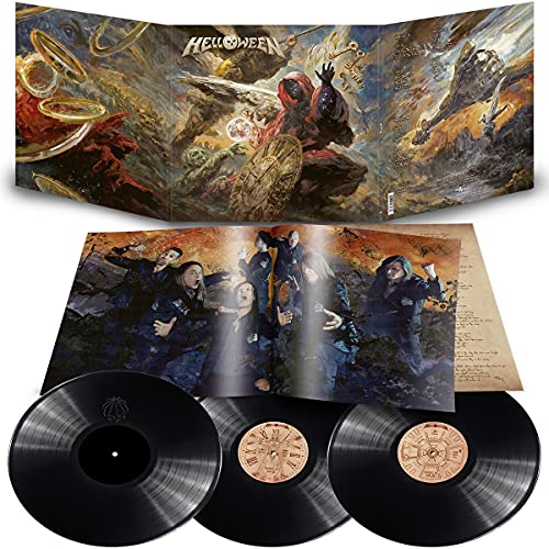 Helloween album cover with fantasy figures, a clock, and celestial imagery.
