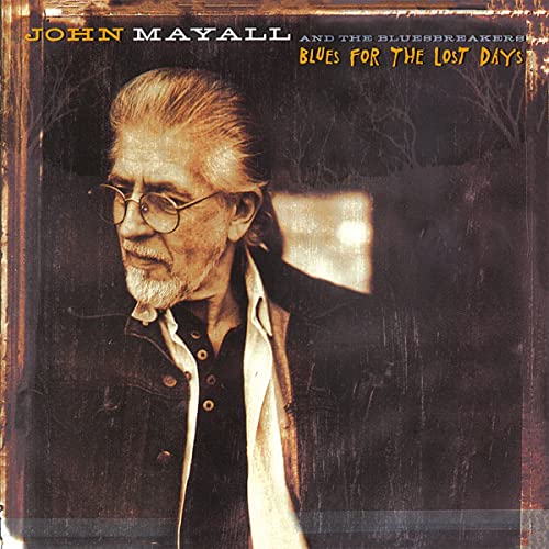 John Mayall album cover, portrait of a man with glasses in front of trees.