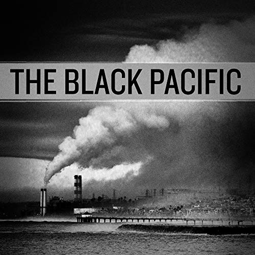 Black and white album cover depicting industrial smokestacks and coastline.