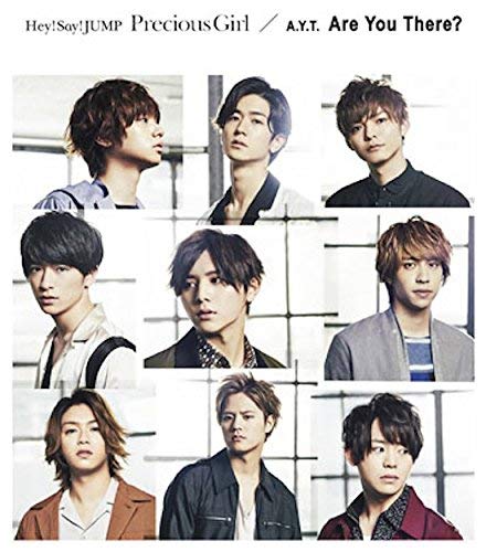 CD cover featuring nine young men with varied hairstyles and expressions.