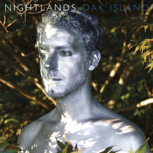 CD cover: Man with silver skin amidst leafy branches.
