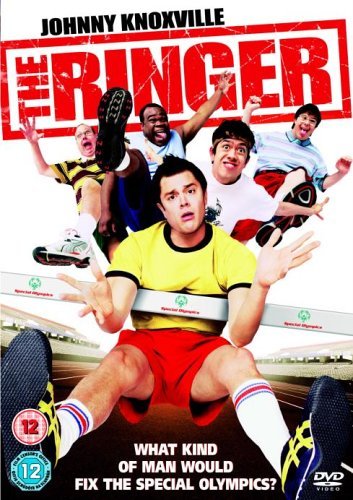 Johnny Knoxville and four other men jumping over a hurdle on a track.