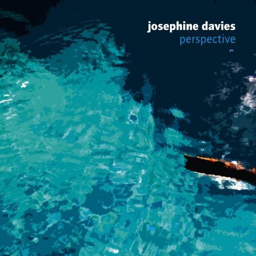 Album cover with abstract blue and turquoise water pattern, artist name and title.