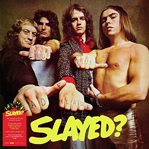 1970s rock band Slade posing with fists spelling out the album title "SLADE?".