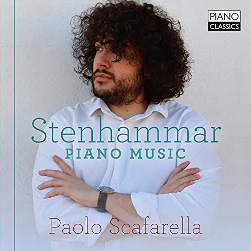 CD cover with a man in white shirt and curly hair.