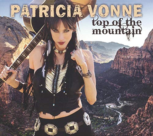 Patricia Vonne album cover featuring a woman with a guitar and mountains.